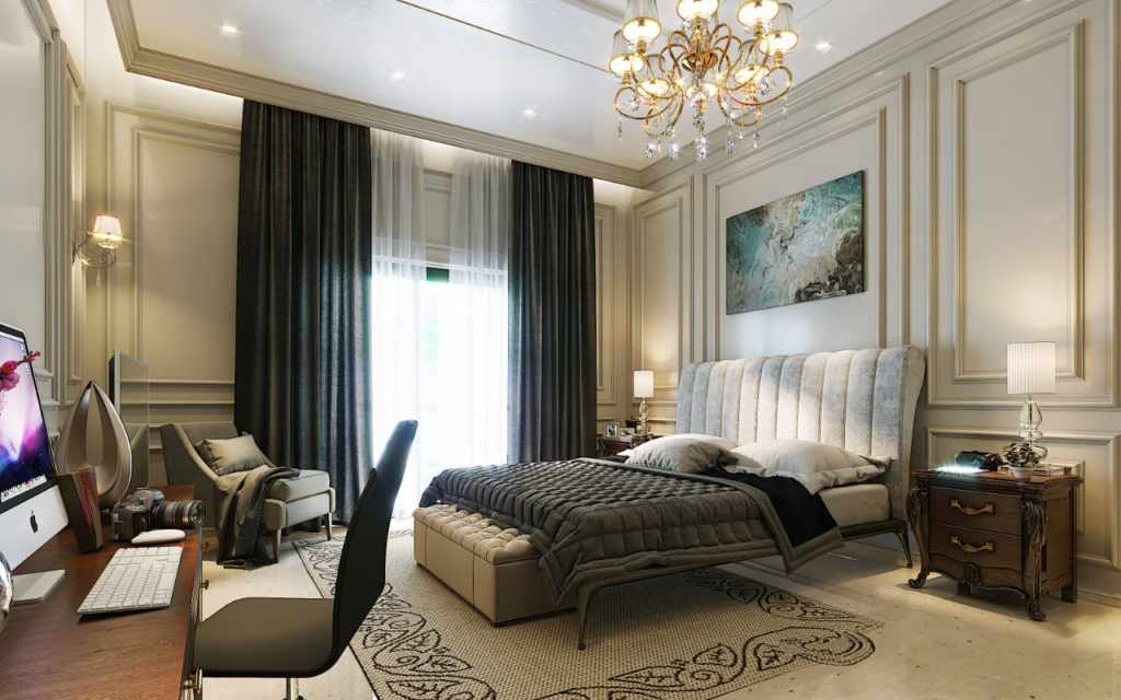 Luxurious bedroom with classic decor, chandelier, and cozy seating area.